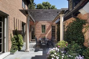 Pergola positioned in courtyard