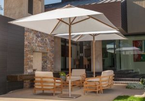 Shade umbrellas for lounge chairs on patio