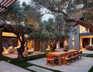 outdoor dining area with shade trees