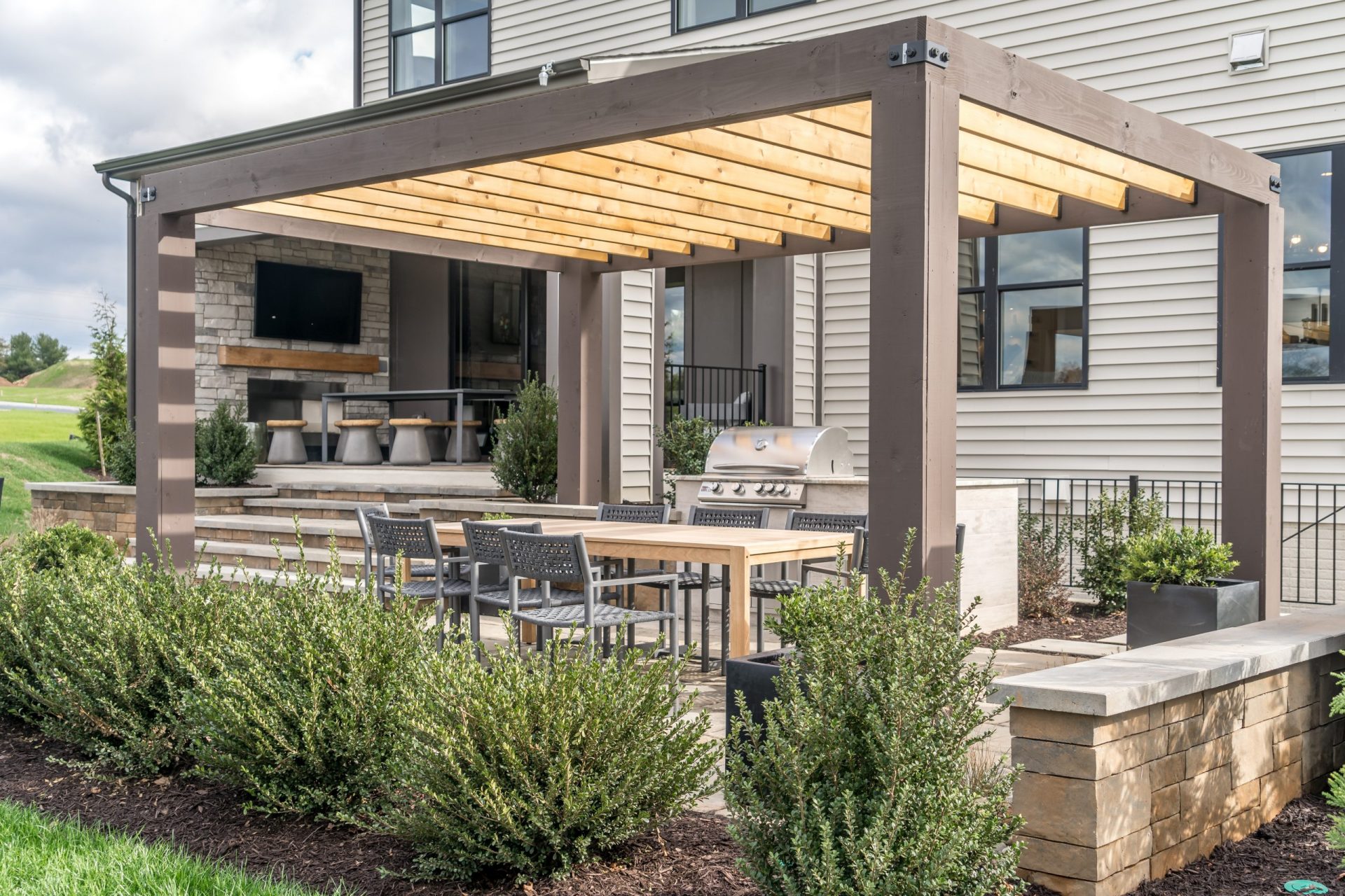 Outdoor pergola with freestanding grill