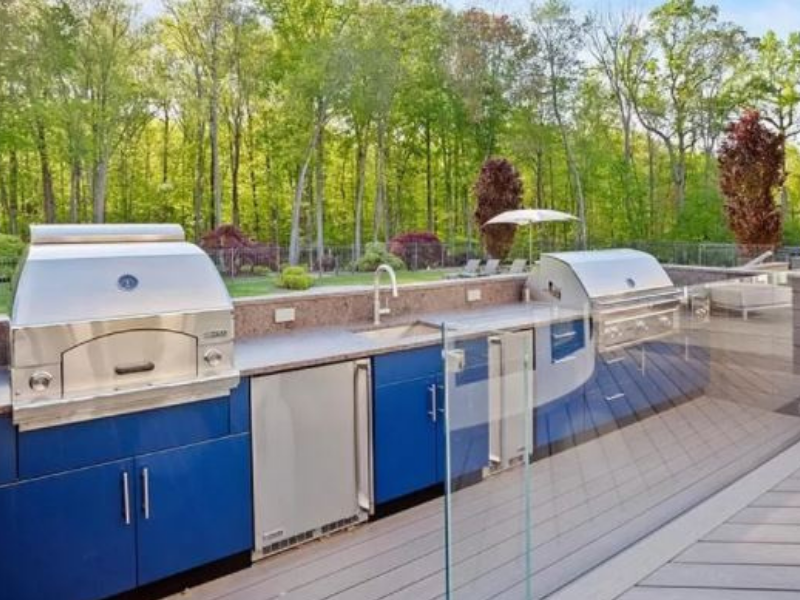 blue powder coated stainless steel cabinets in modern outdoor kitchen