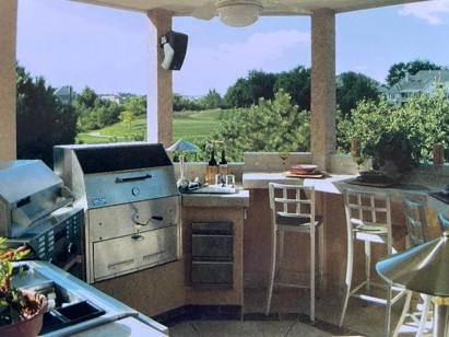 outdoor kitchen and bar built inside of an open air gazebo