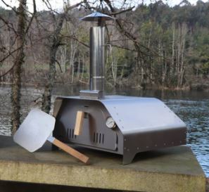 portable outdoor pizza oven on a table