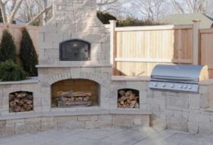 pro built outdoor kitchen with pizza oven