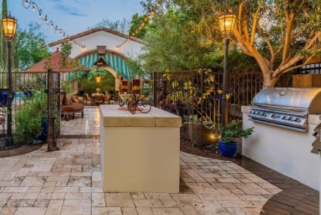 large patio with stucco grill island and prep island