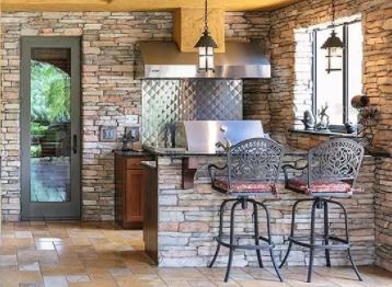 stone kitchen with wrought iron accents in spanish style