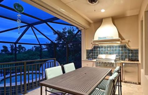 outdoor kitchen on balcony with handmade tile backsplash