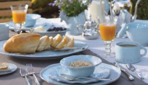 Family breakfast table setting outdoors