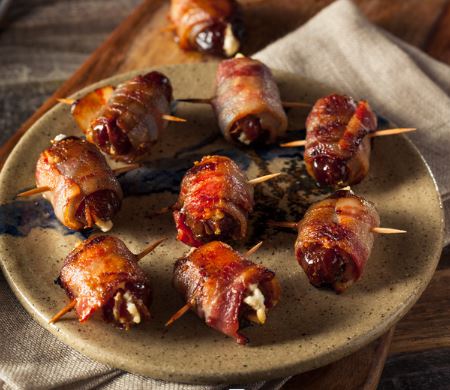 a plate of pig shot appetizers fresh off the grill