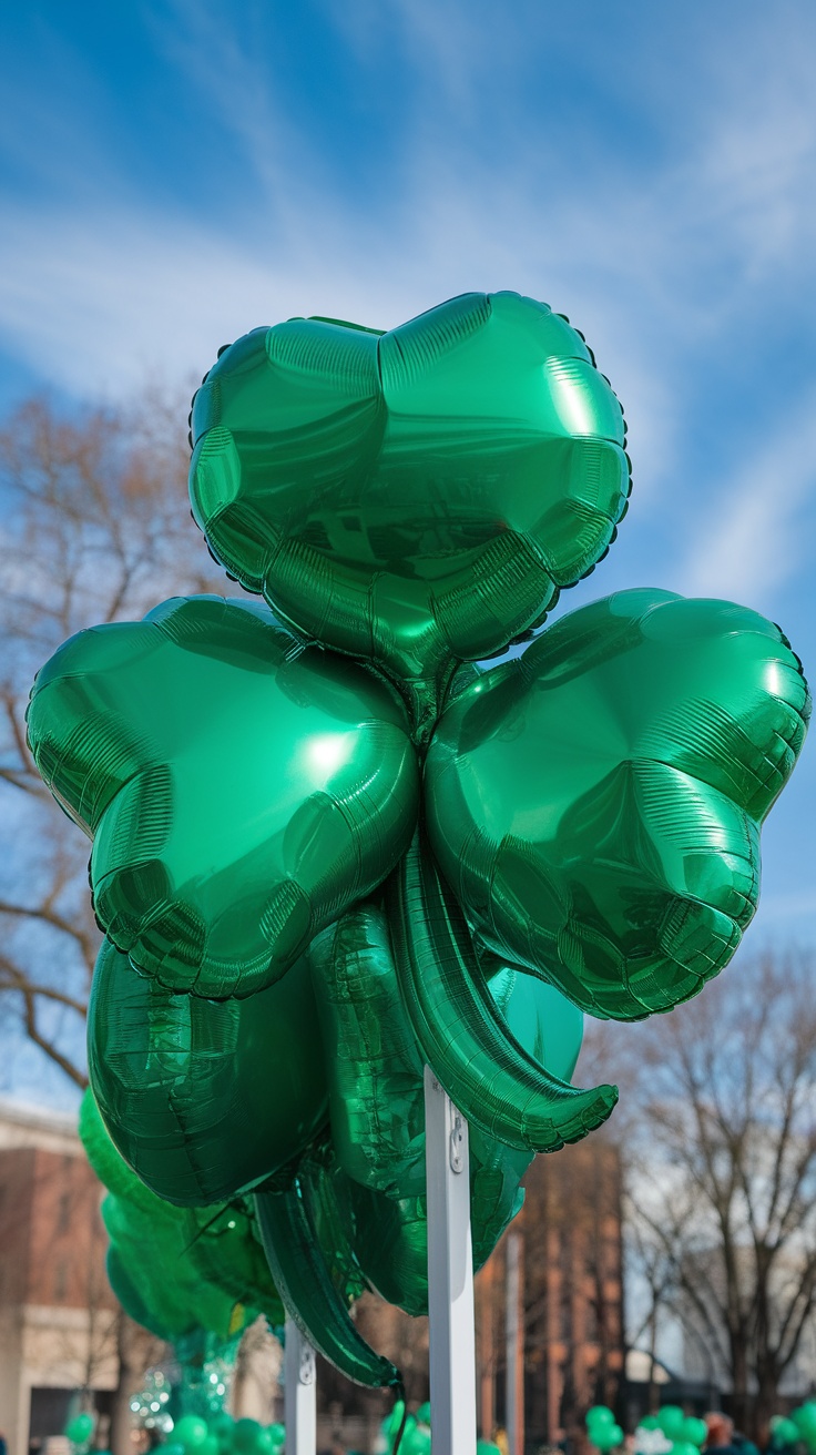 Giant green shamrock-shaped balloons against a blue sky