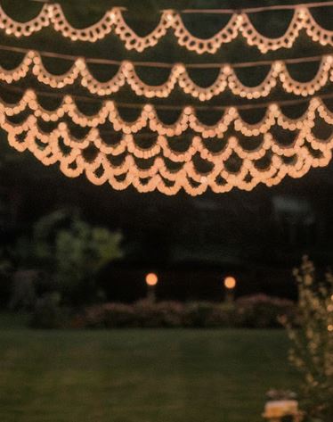 Fancy scalloped string lights in a backyard